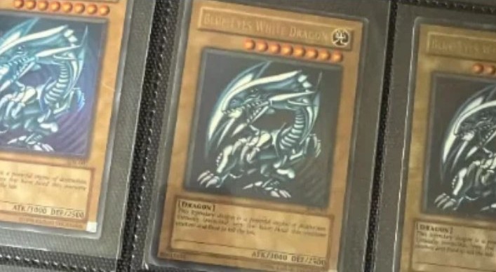 Blue-Eyes White Dragon Yu-Gi-Oh! cards in a collector binder